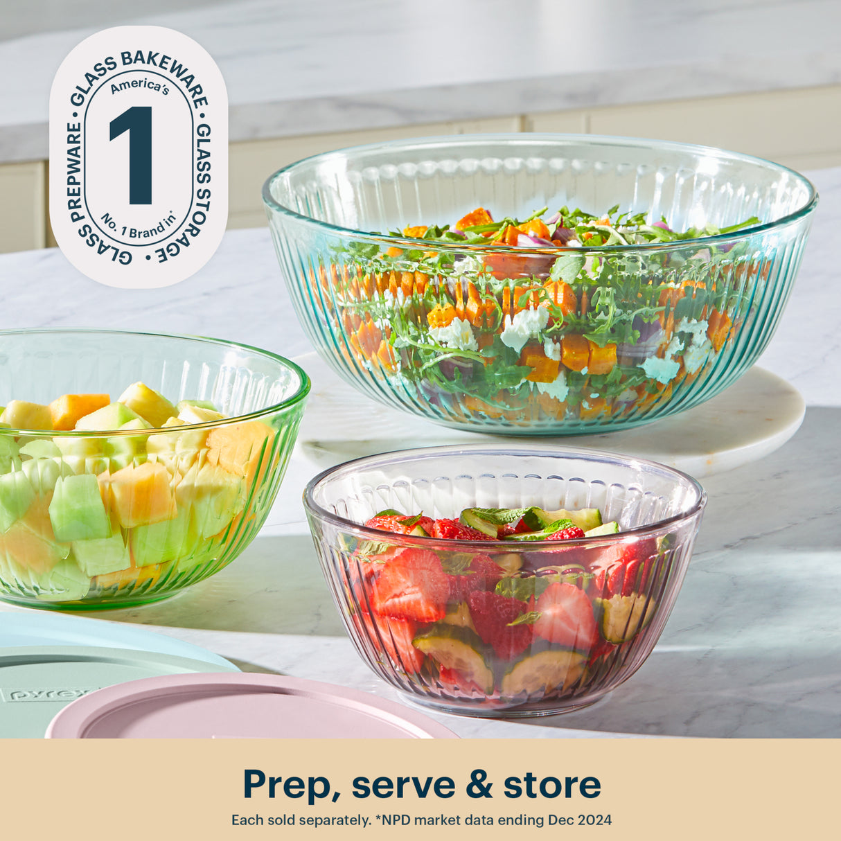 Three glass bowls with salad on a kitchen counter, featuring Glass Prepware branding.
