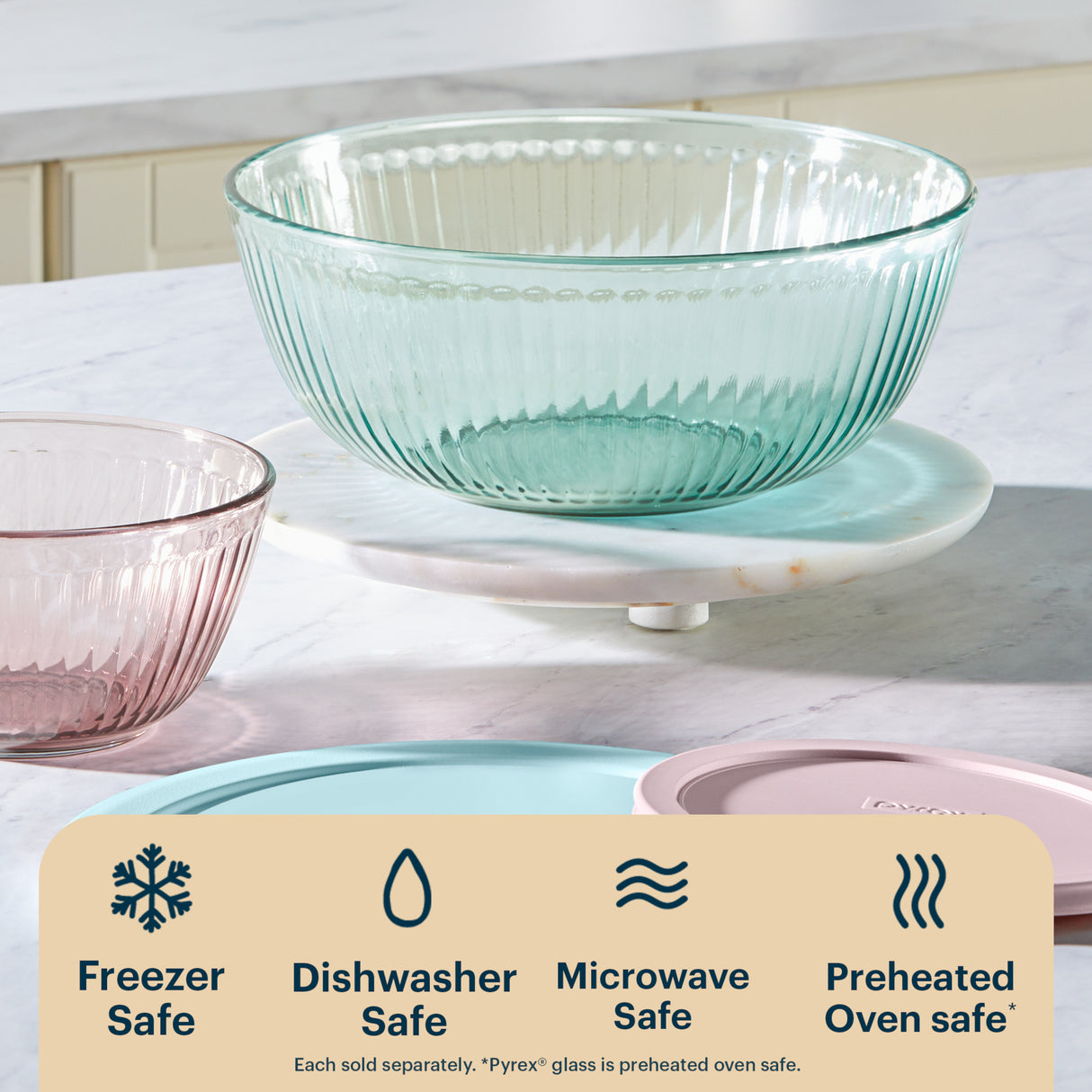 Clear glass bowl on a kitchen counter with safety icons and text.