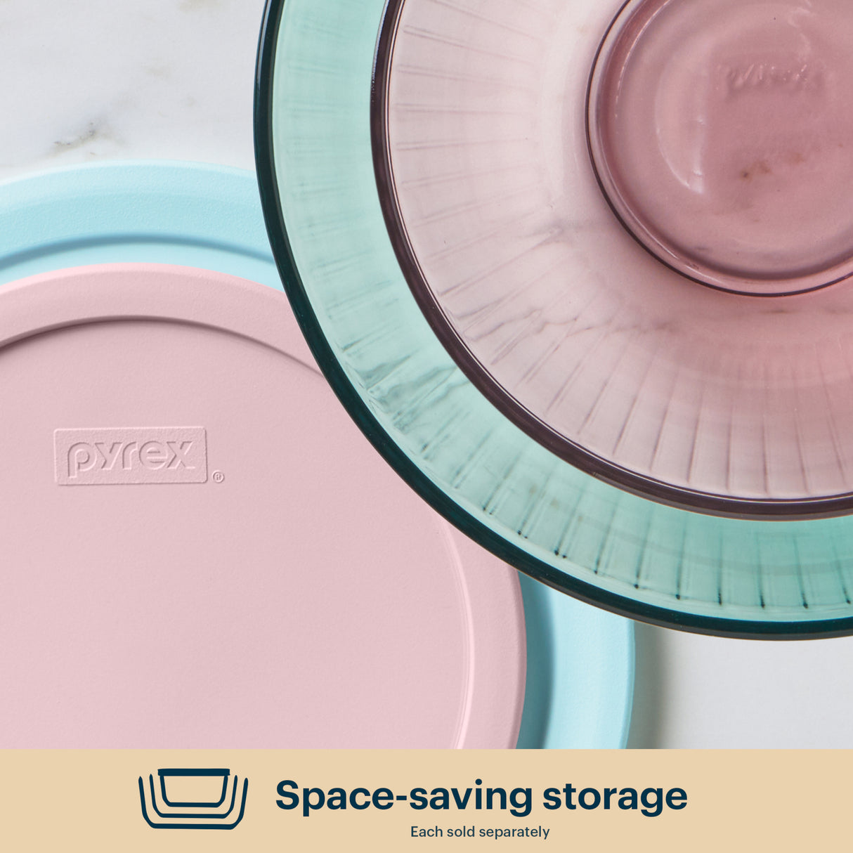 Pyrex storage containers with lids on a white background