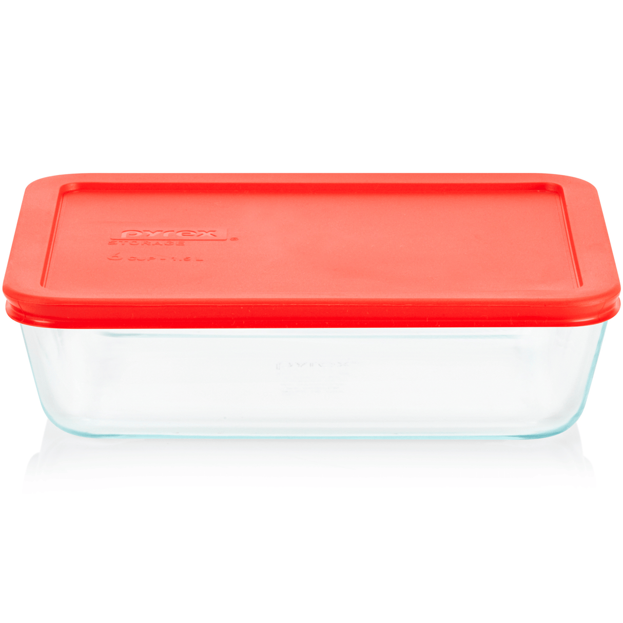 Clear glass food storage container with a red lid on a white background