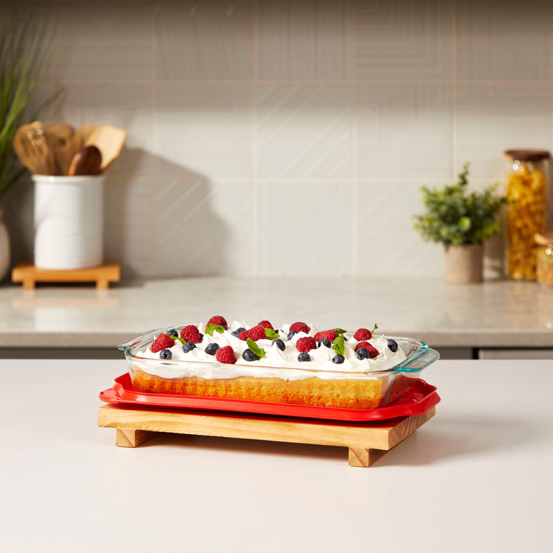 Pyrex bakeware with a cake on a stand