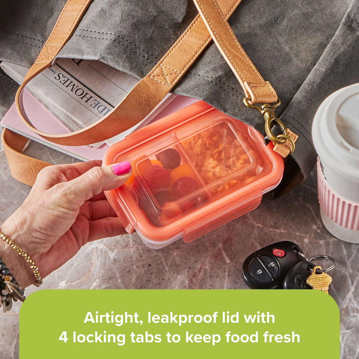 Meal Prep 2-section Divided: 2-cup Rectangle Storage Container with orange lid being used in a to-go tote