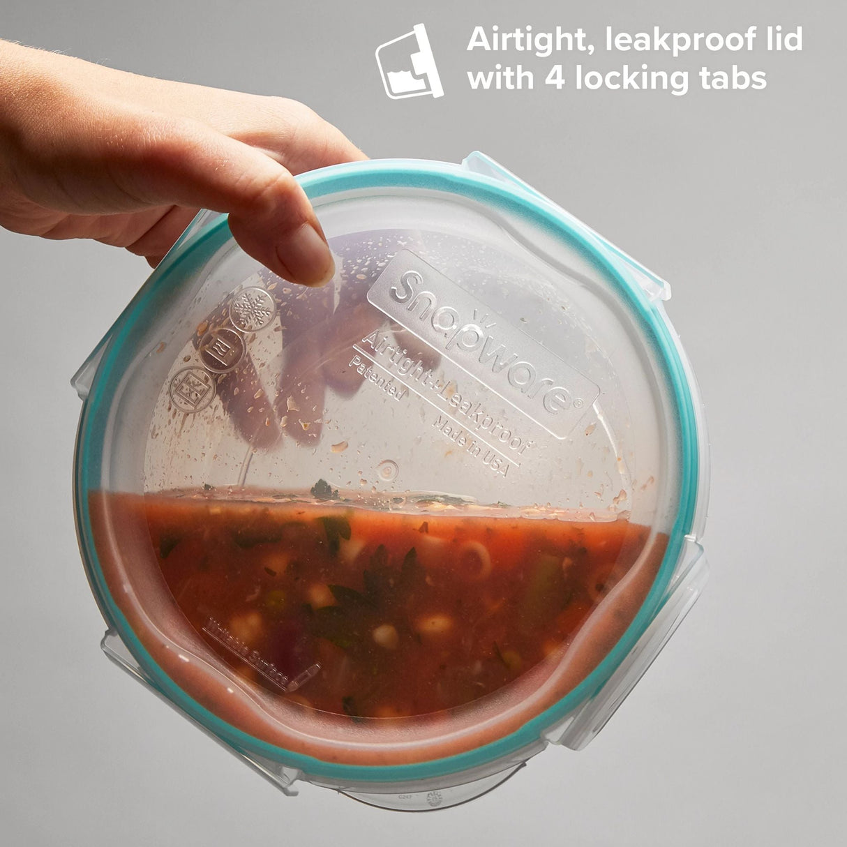 Total Solutions bowl with lid on with text airtight leakproof lid with 4 locking lids