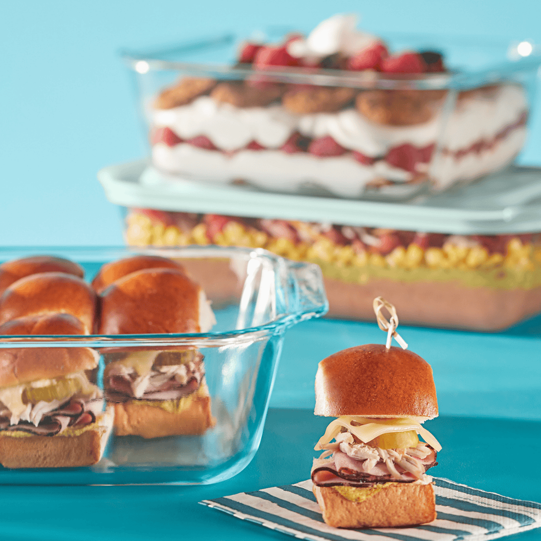 Mini sandwiches on buns with a blue background