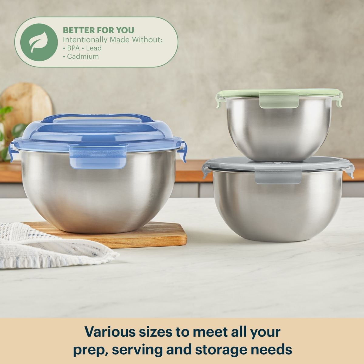 Set of stainless steel bowls with lids on a kitchen counter, emphasizing safety and versatility.