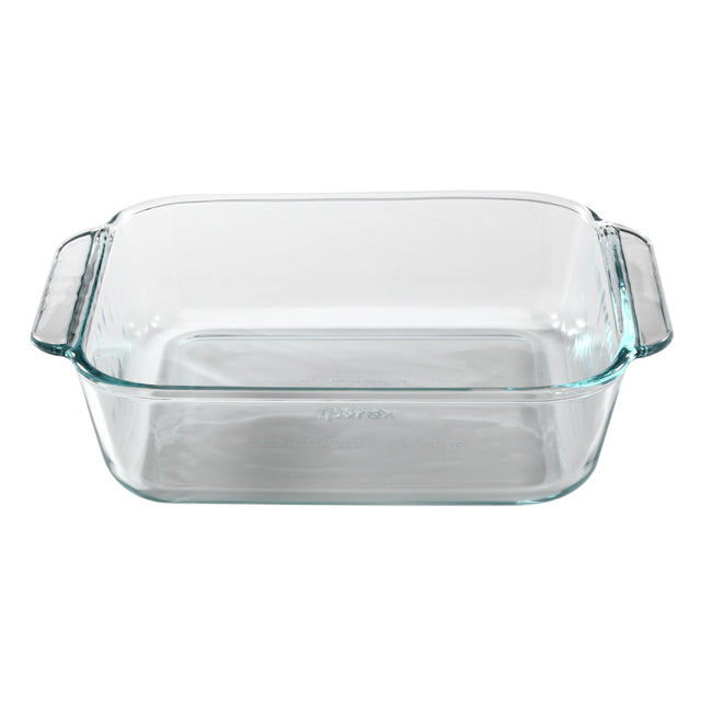 Clear glass baking dish with handles on a white background