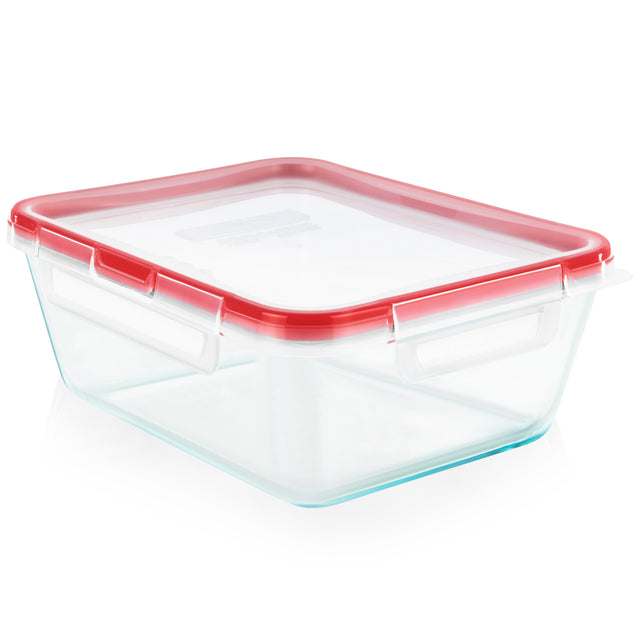 Clear glass food storage container with red lid on a white background