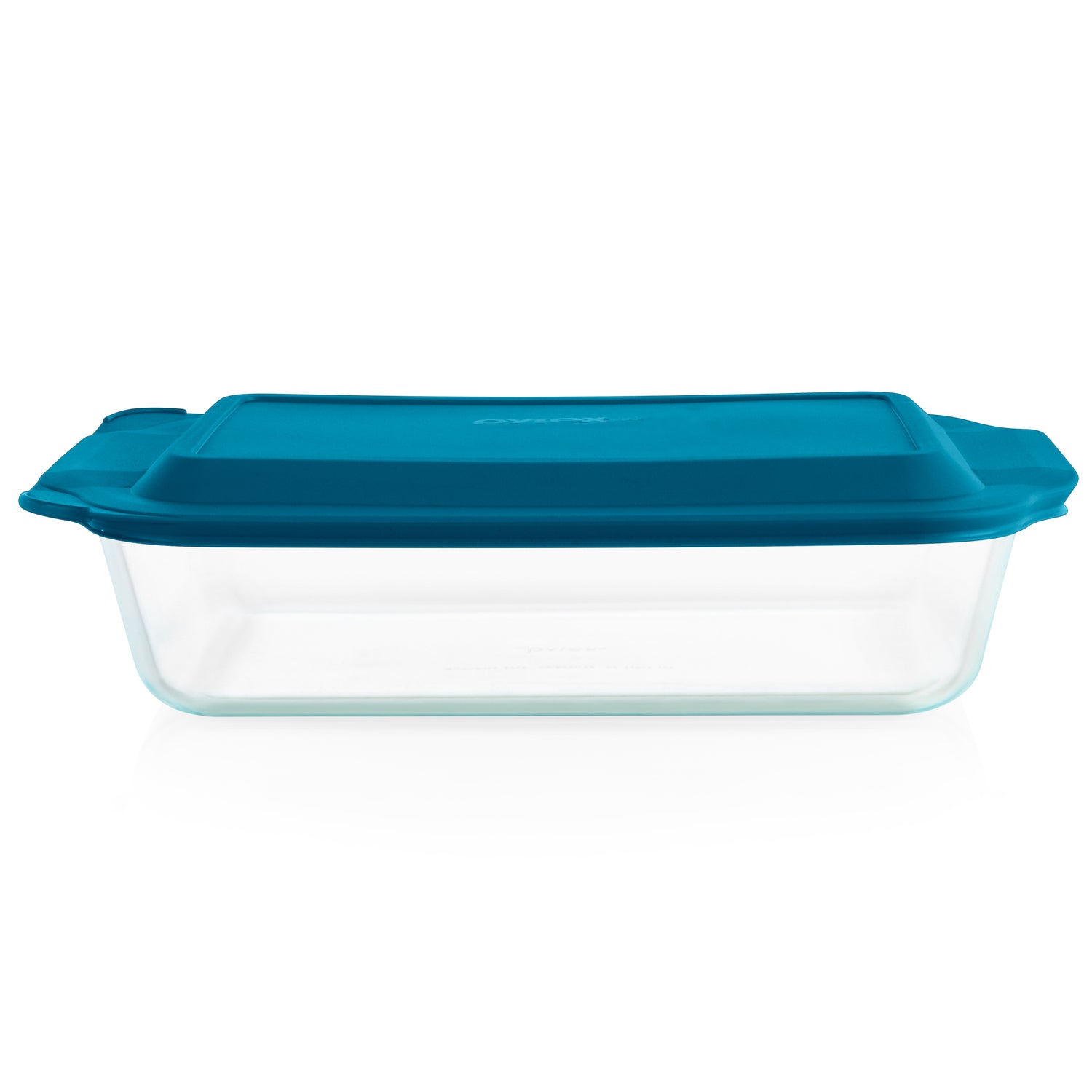 Clear glass baking dish with a blue lid on a white background