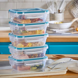  Total Solution™ 10-piece Rectangular Plastic Food Storage Set on counter with food inside. containers stacked
