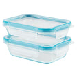 Two clear food storage containers with blue lids on a white background