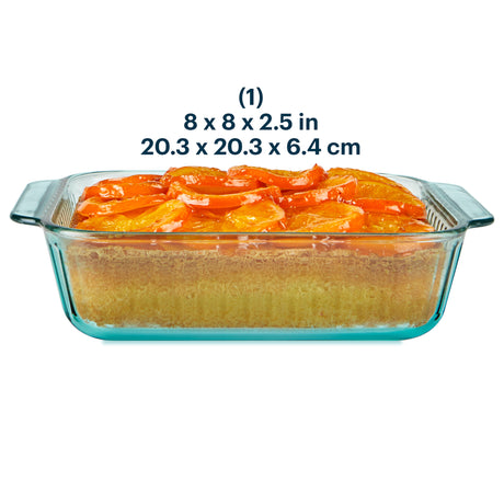 Glass baking dish with a cake inside, showing dimensions on a white background
