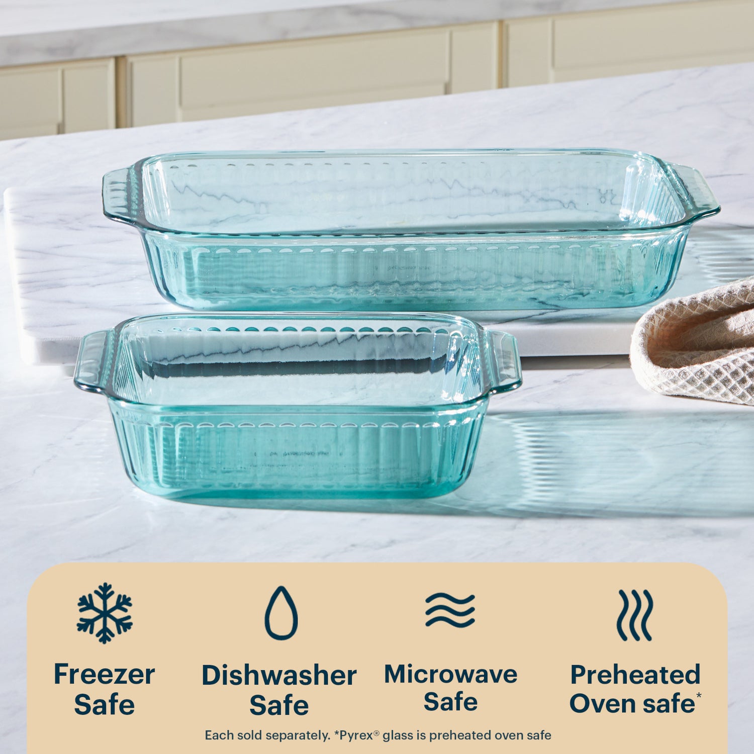 Two glass baking dishes on a marble countertop with safety features listed below.