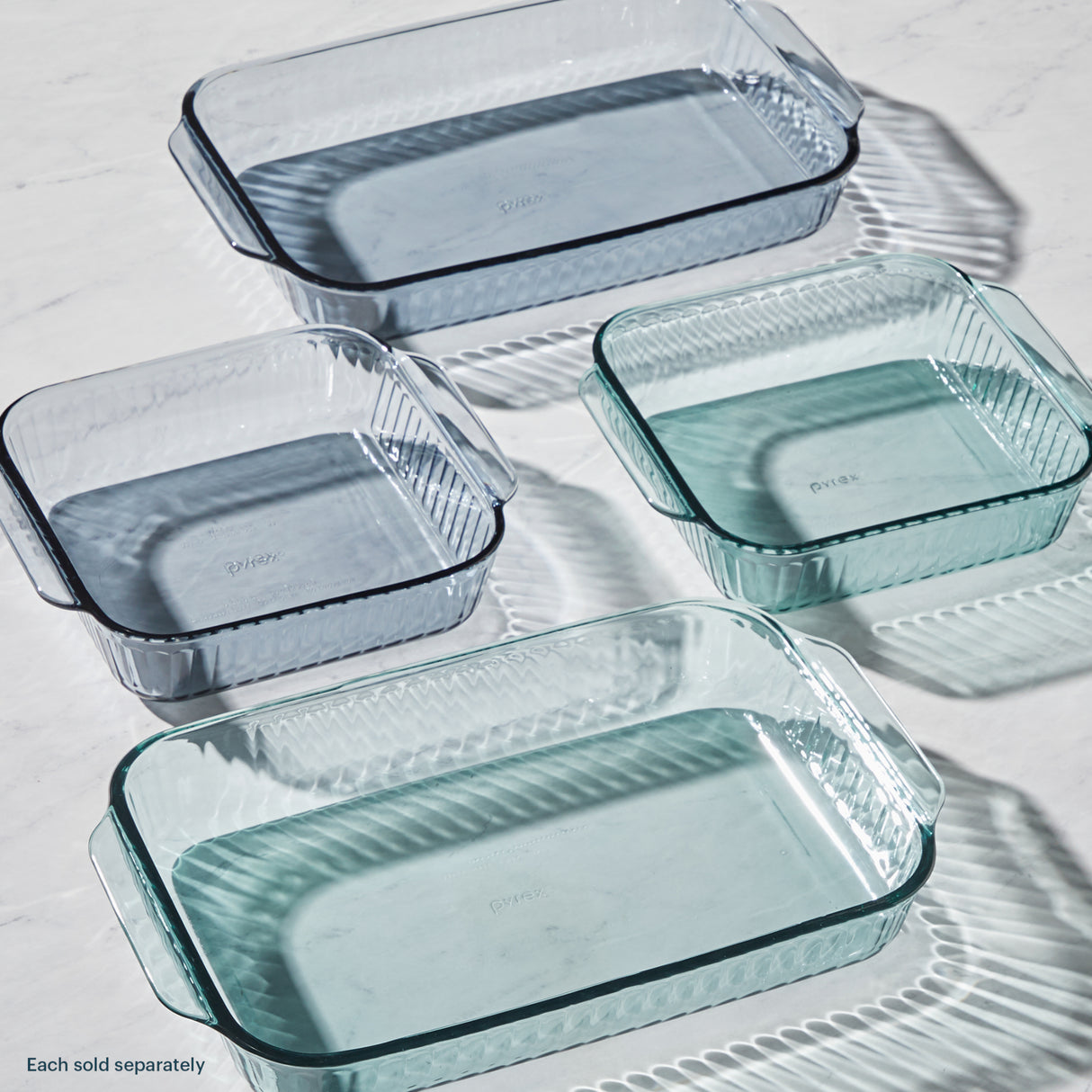 Set of glass baking dishes on a light background
