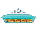 Glass baking dish with teal lid containing salmon fillets, dimensions displayed.