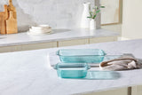 Set of glass baking dishes on a kitchen counter with a neutral background