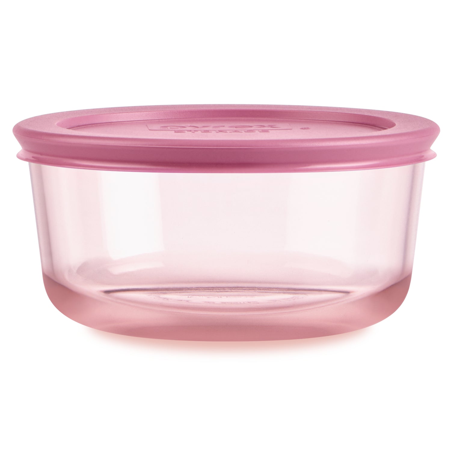 Pink food storage container with lid on a white background