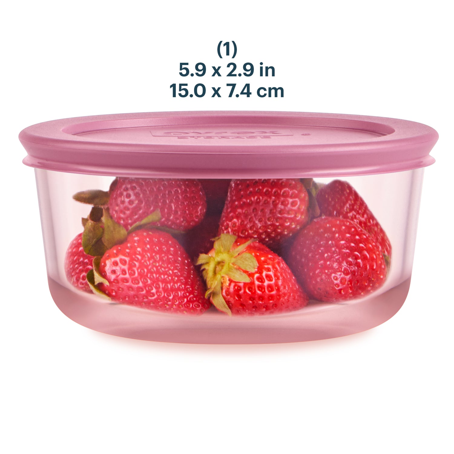 Pink food storage container with strawberries inside on a white background