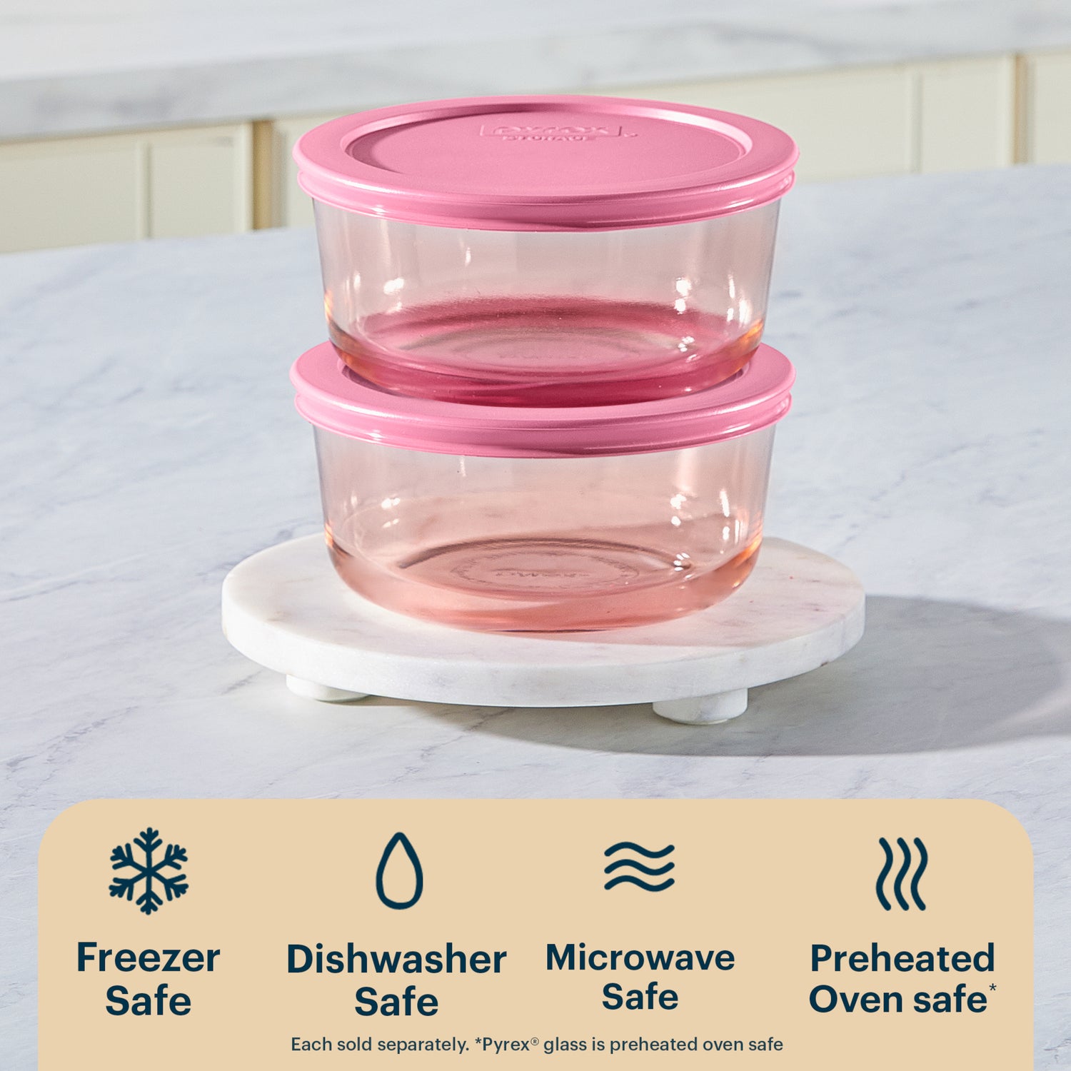 Set of pink food storage containers with a white base on a light background