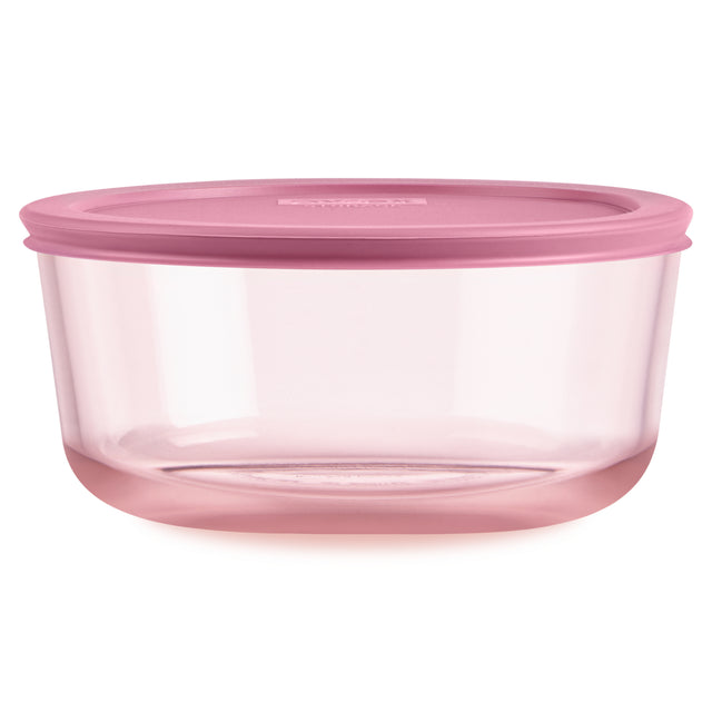 Pink food storage container with a lid on a white background