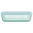 Light blue glass container with lid on a white background