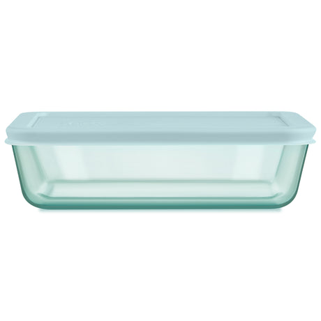 Light blue glass container with lid on a white background