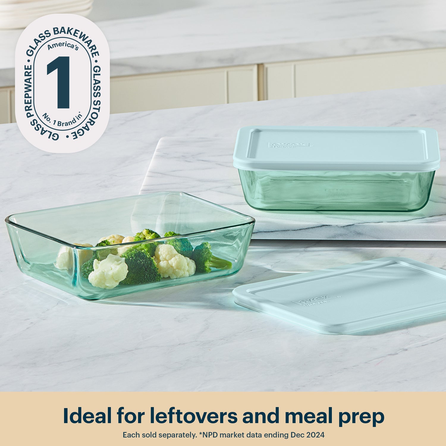 Glass food storage containers on a marble surface with text about meal prep.