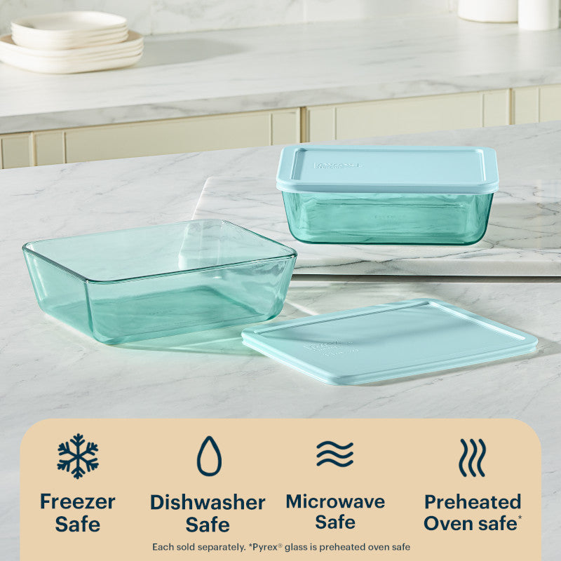 Two glass food containers with lids on a kitchen counter, featuring icons and text about safety.