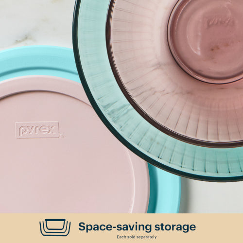 Pyrex storage containers with lids on a light background