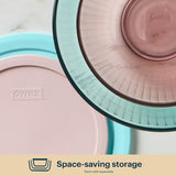 Pyrex storage containers with lids on a light background
