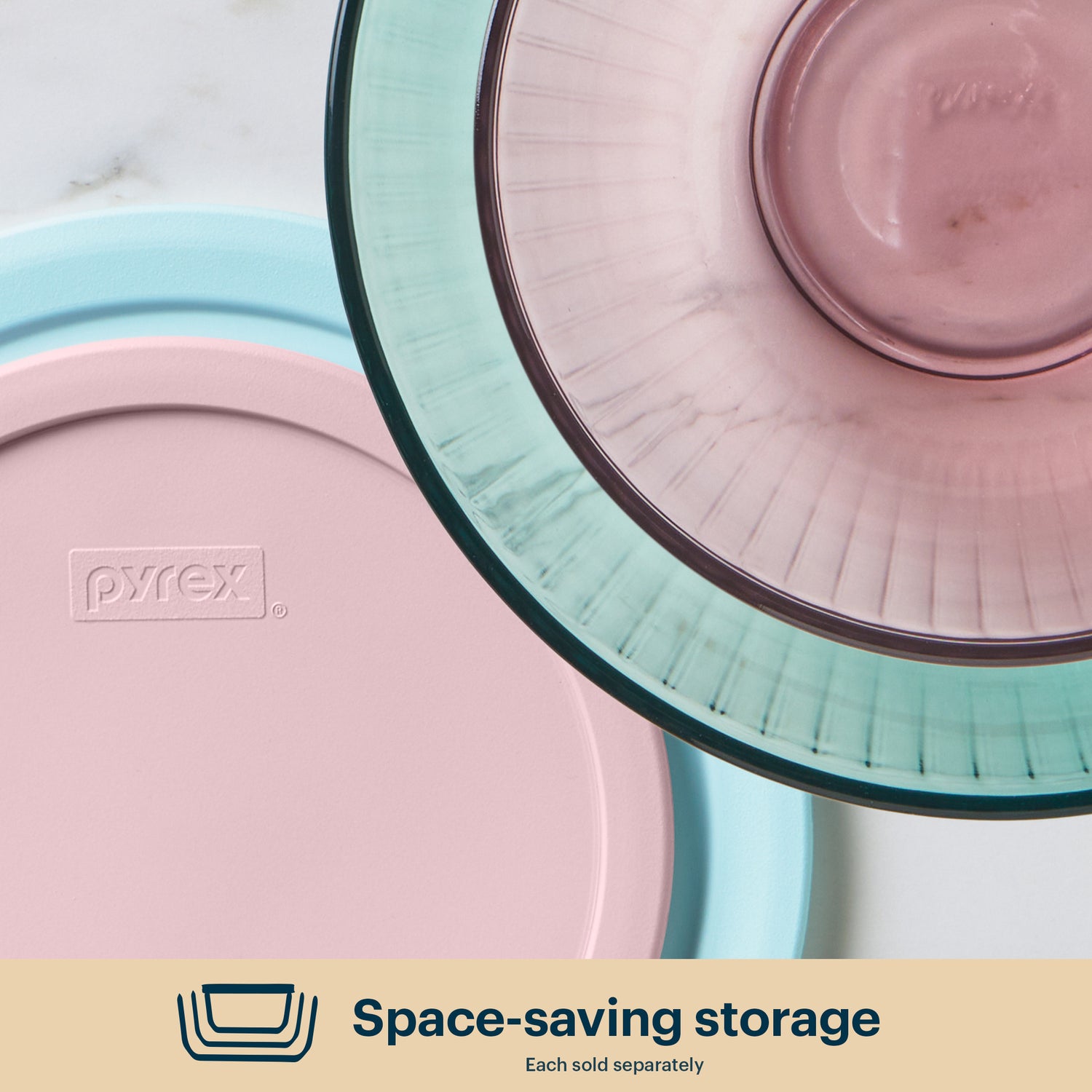 Pyrex storage containers with lids on a light background