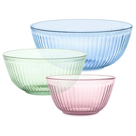 Three glass bowls in blue, green, and pink on a white background