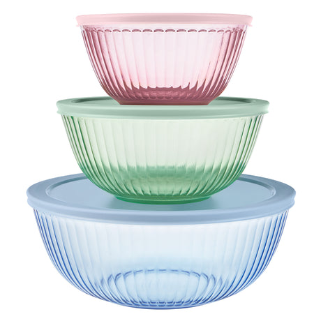 Three stacked glass bowls in pink, green, and blue on a white background