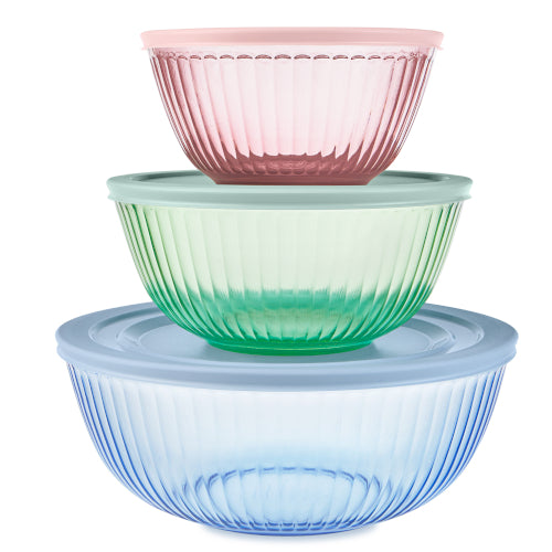 Set of three colorful glass bowls stacked on a white background