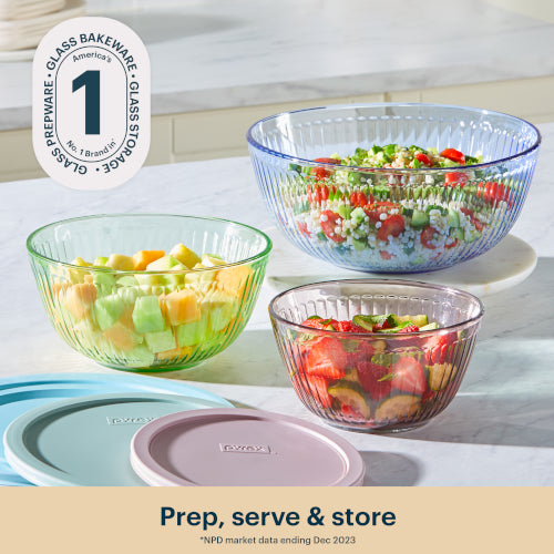 Glass bowls with salad on a kitchen counter, featuring Glass Prepare branding.