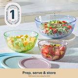 Glass bowls with salad on a kitchen counter, featuring Glass Prepare branding.