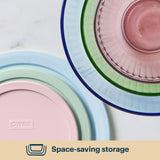 Stack of Pyrex dishes in pastel colors on a white background with 'Space-saving storage' text.