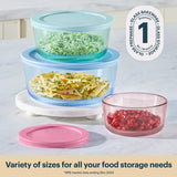 Set of glass food storage containers with lids on a countertop.