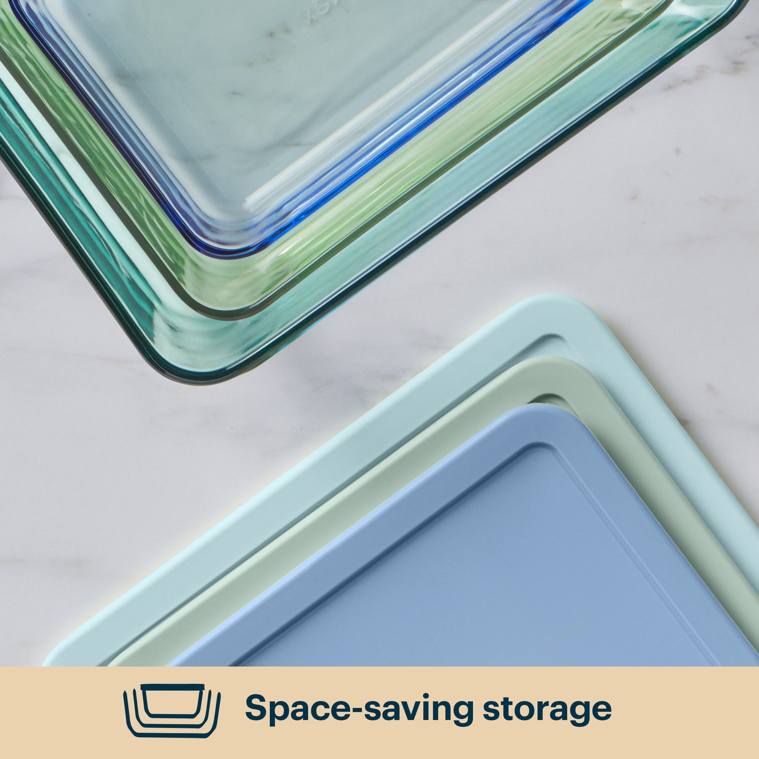 Stack of glass food storage containers on a light background with 'Space-saving storage' text.
