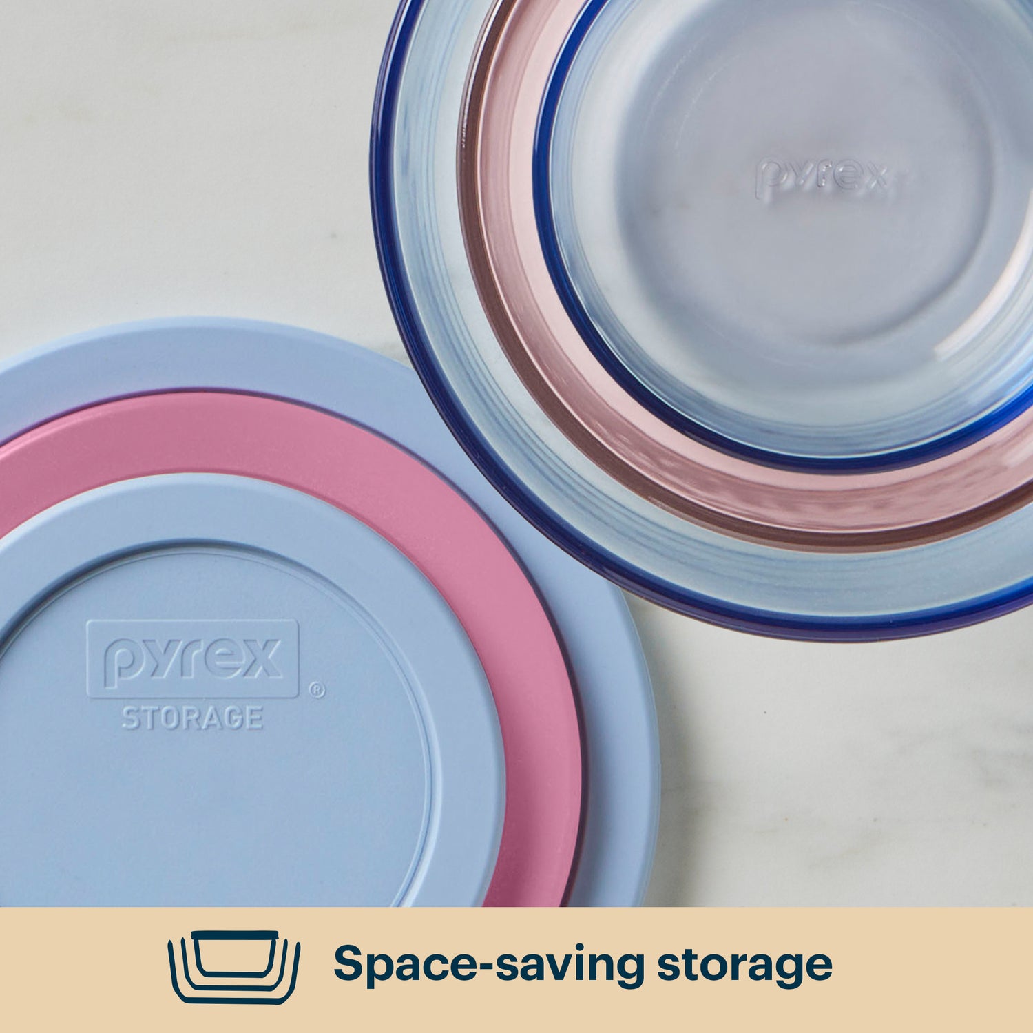 Pyrex storage containers with lids on a light background