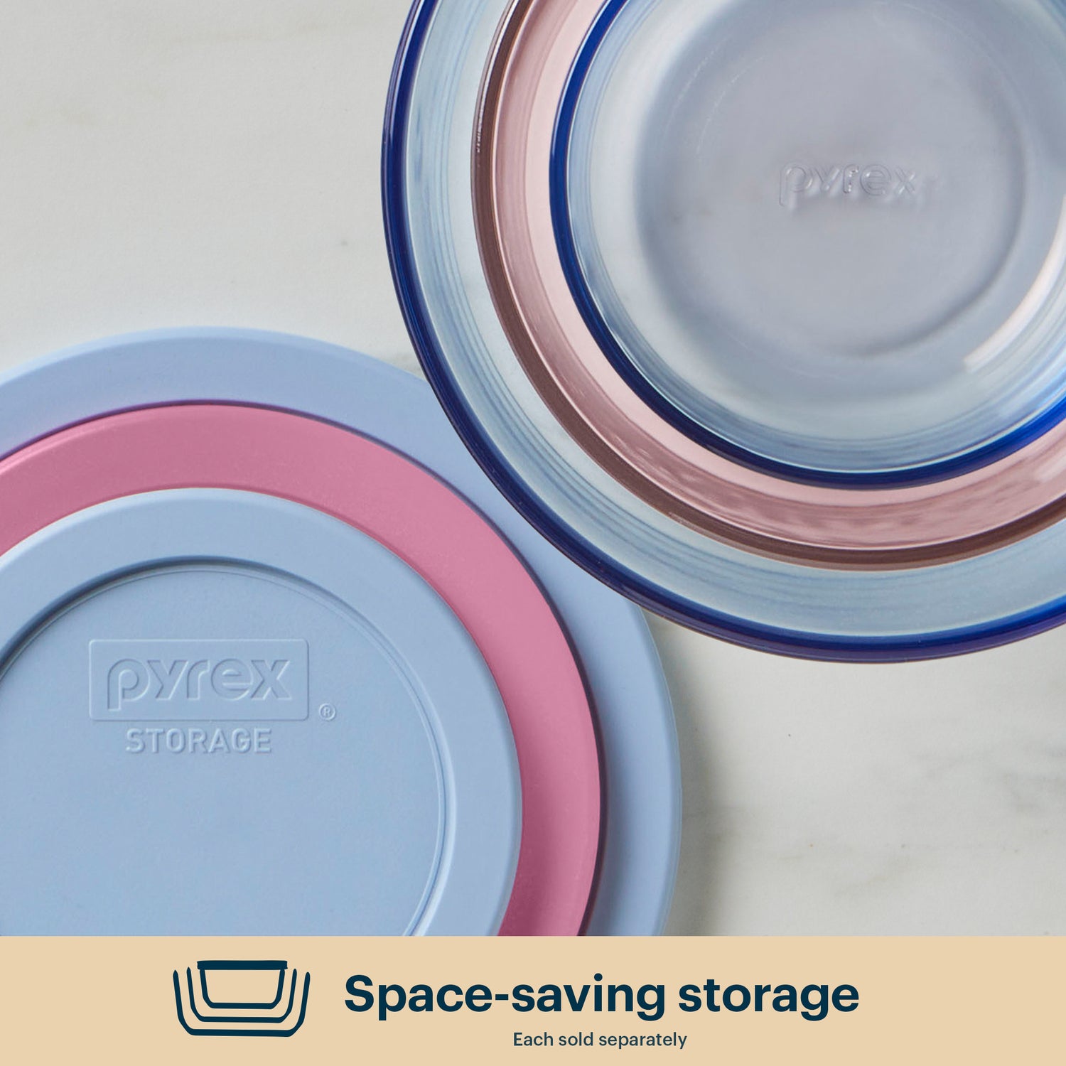Pyrex storage containers with lids on a light background