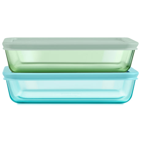 Two glass food storage containers with lids on a white background