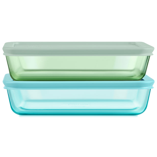 Two glass food storage containers with lids on a white background