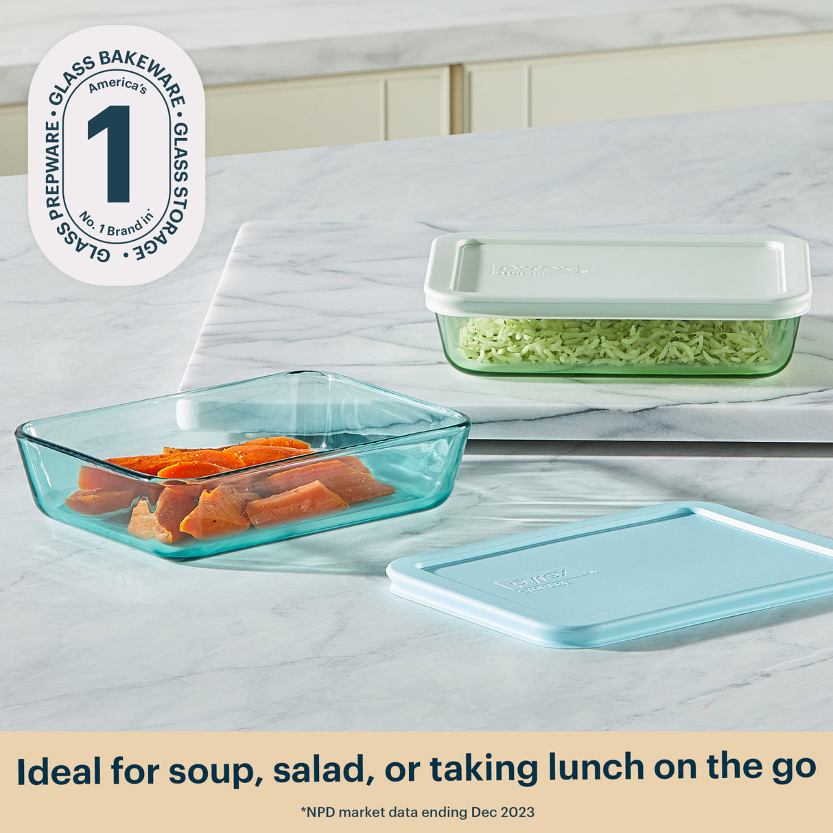 Glass food storage containers with lids on a marble surface, featuring the brand logo.