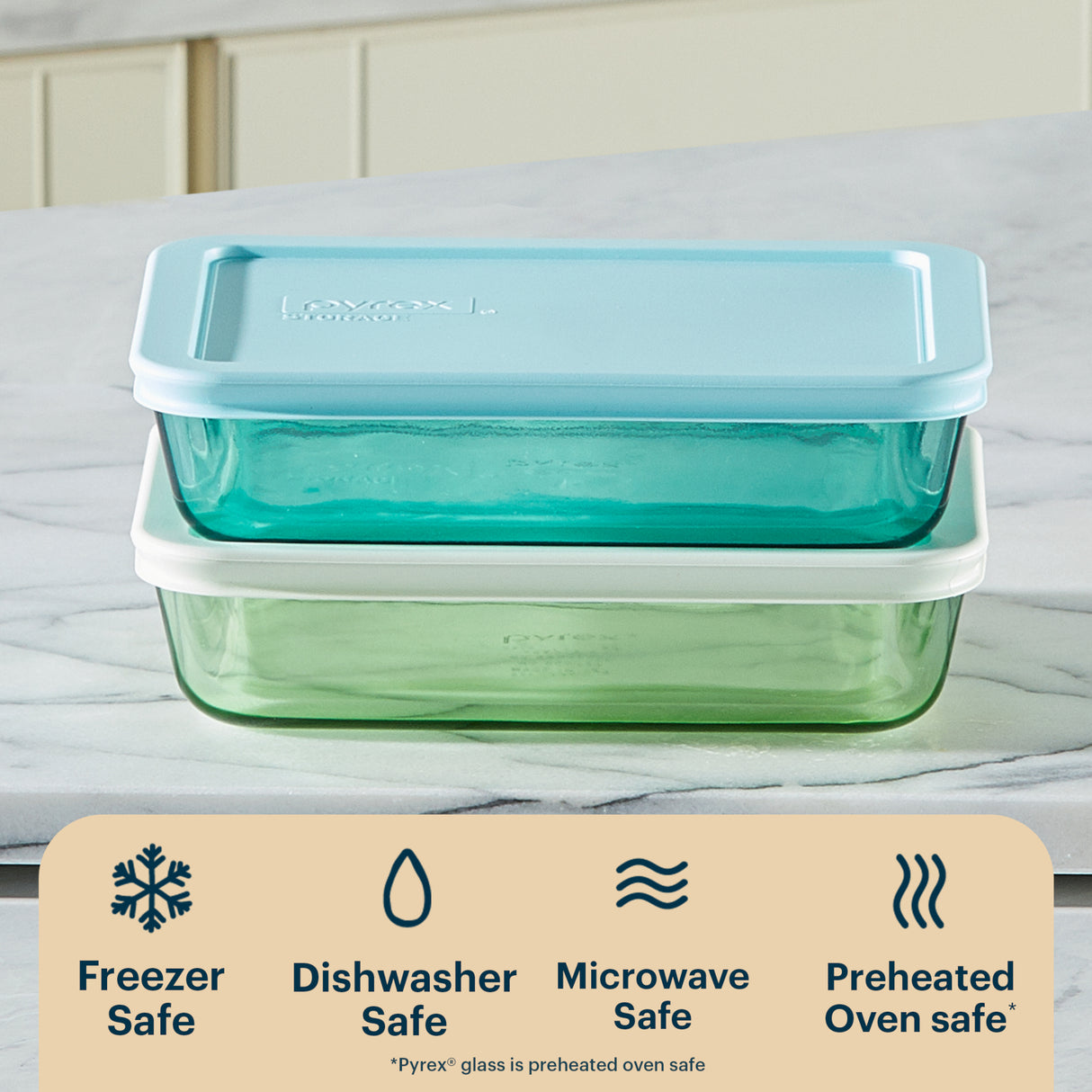 Glass food storage containers with blue lid on a white surface, featuring safety icons and text.