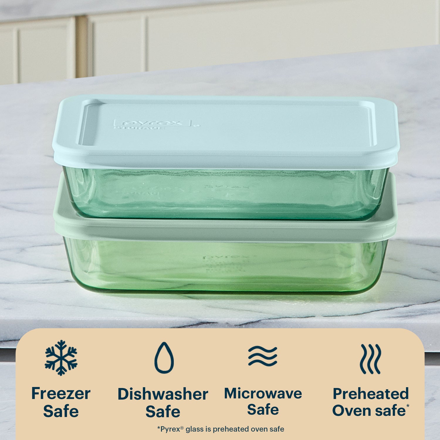 Green glass food storage container with a white lid on a white background, featuring safety icons and text.