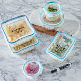 Containers with labeled lids on a marble surface, featuring text about writeable and erasable lids.