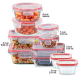 Set of glass food storage containers with red lids, filled with various foods, on a white background.