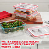 Glass food storage containers with labels on a kitchen counter