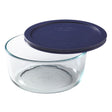 Clear glass container with a blue lid on a white background