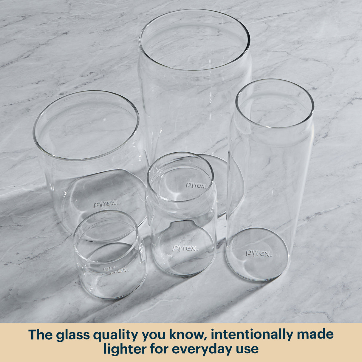 Pyrex glass canisters on a kitchen counter